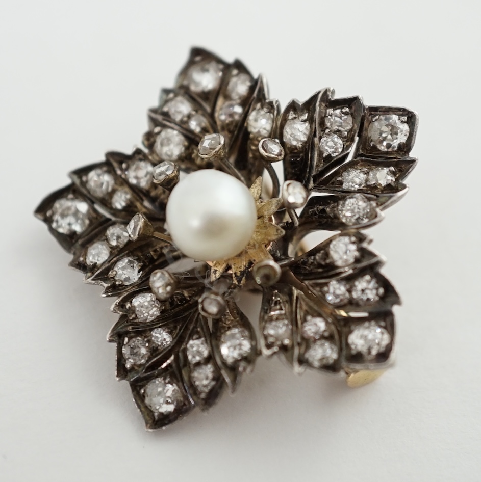 A Victorian gold and silver, pearl and diamond cluster set flower head pendant brooch